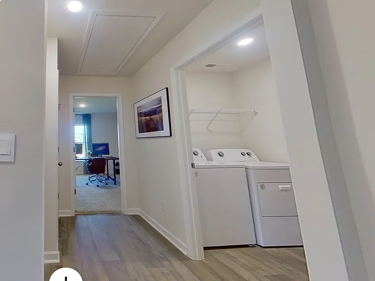 Laundry room and entry to Bedroom 4 / Office, with large closet across the hall, along with entry to garage