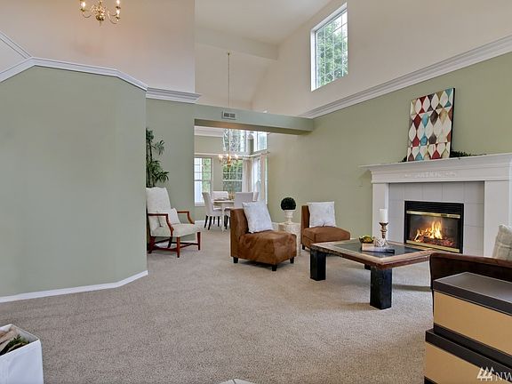 Enter to vaulted ceilings in this grand living room*Peer out to the river from almost every room in this home*Cozy gas fireplace with custom mantle*Brand new carpet*