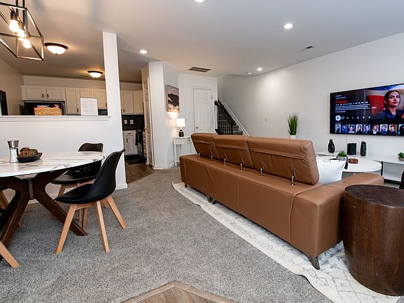 Open floorplan that seamlessly flows from the living to dining room to the kitchen.