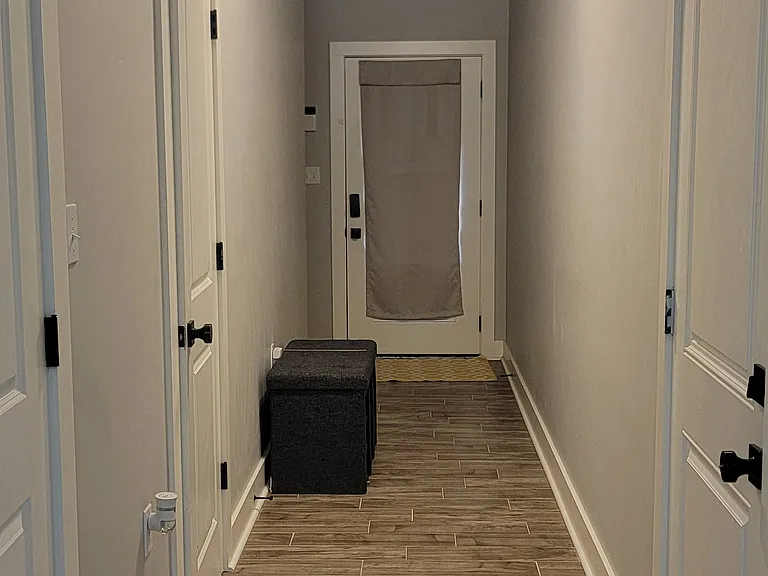 downstairs hallway to back door, garage door, walk-in pantry door and half bath