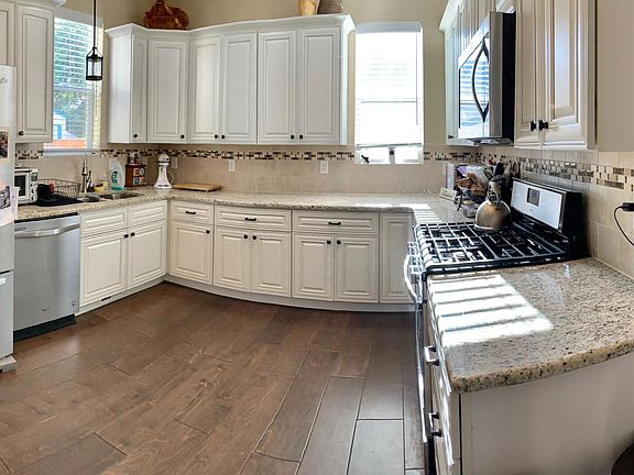 Designer kitchen with granite countertops.