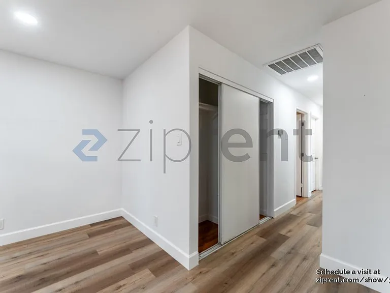 hallway with closets