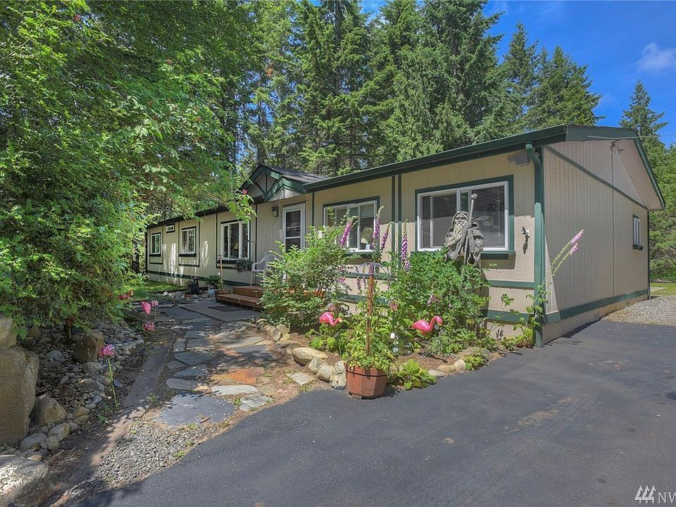 Well maintained doublewide. Easy entry, lovely gardens, quiet and private location. New asphalt drive.