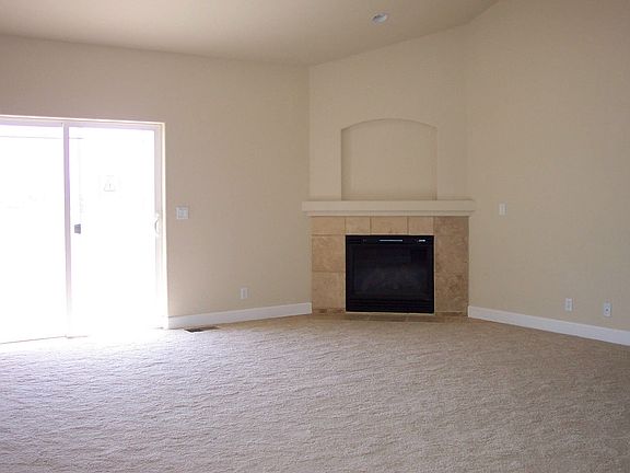 Vaulted ceilings & fireplace in the spacious great room.