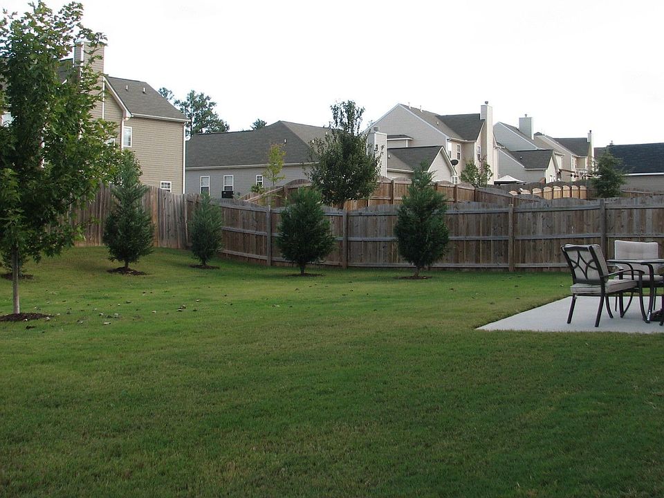Large backyard with fence