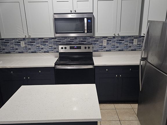 Fully renovated Kitchen with Brand New Cabinets/Countertops and Stainless Steel Appliances