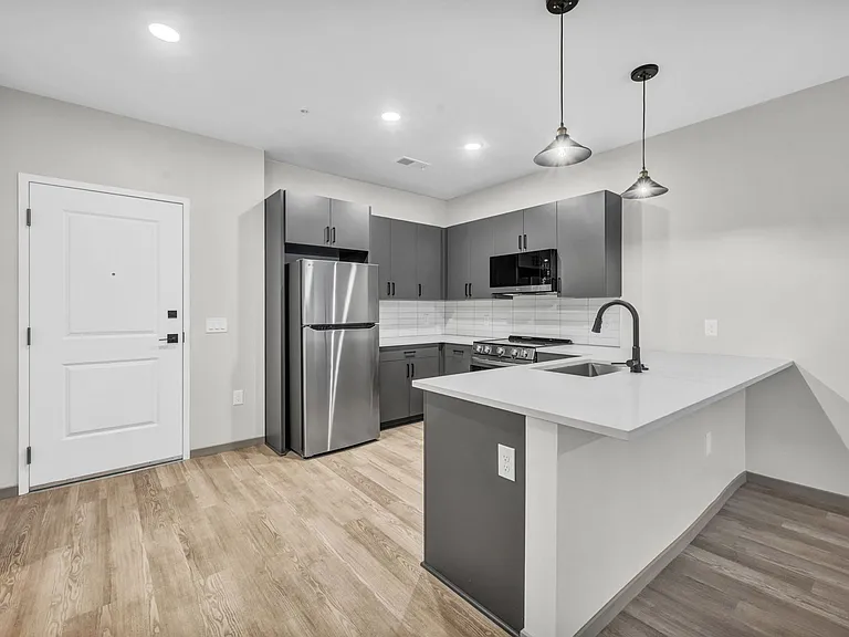 Dark Granite and Charcoal Cabinetry
