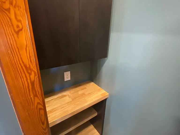 New pantry with 2 upper cabinets, 2 counter spaces for smaller appliances, 2 outlets on either side, and plenty of open shelving lowers.