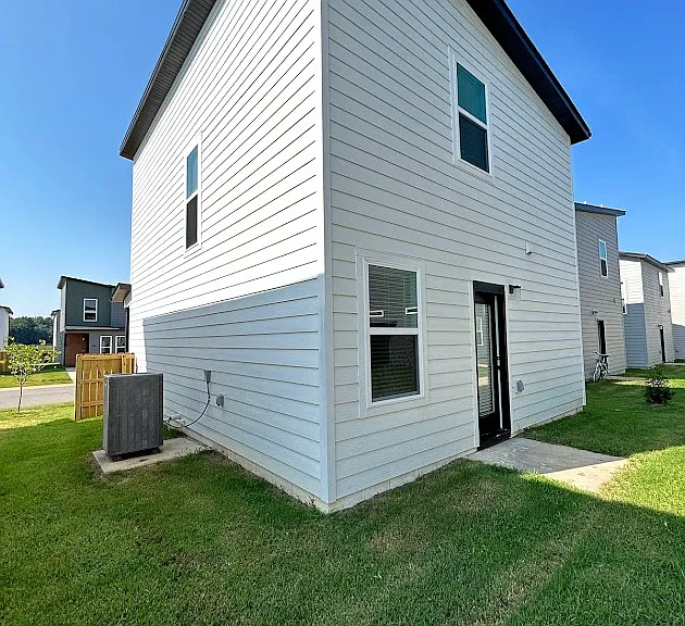 A patio just outside the back door. Lawn care is included in rent.