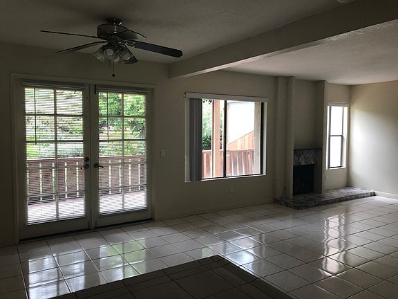 Dining area with French doors that open to the back porch and green belt.