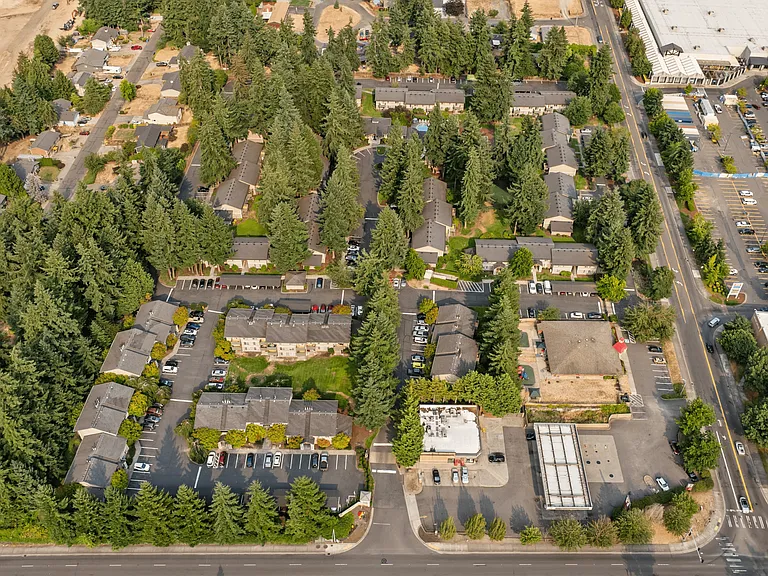 Discover a peaceful apartment community nestled among tall evergreens with easy access to nearby shopping and dining.