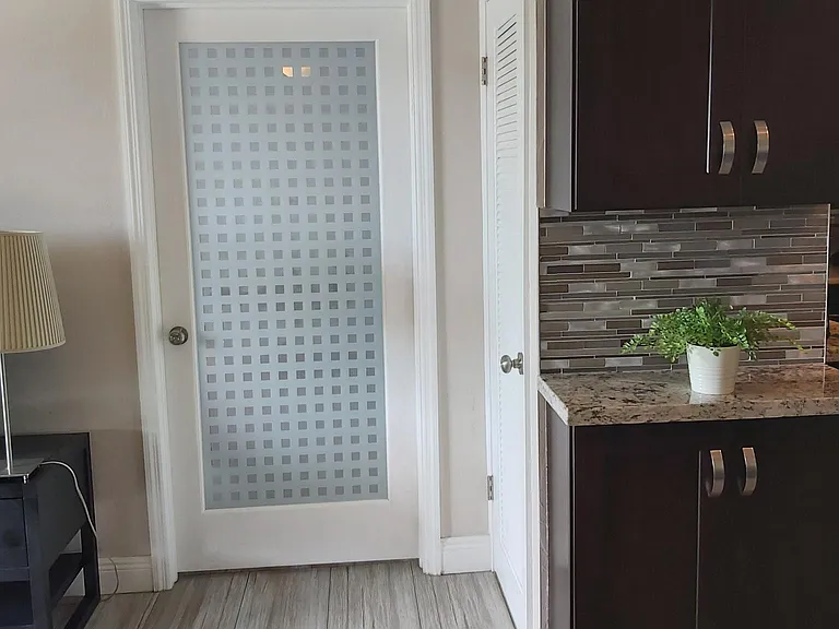 Living room glass door to entering the room.