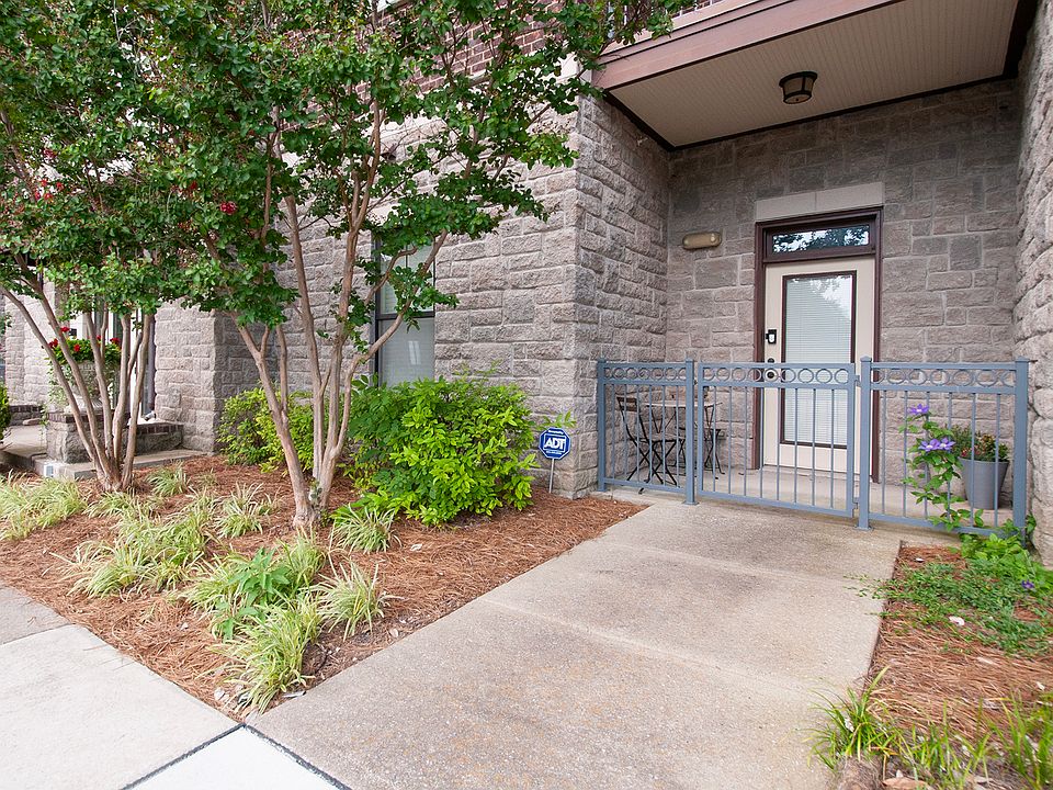 Unit 102 has private street access through a covered front porch overlooking Dragon Park