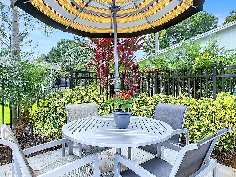 Enjoy lunch by the pool at our poolside tables with umbrellas.