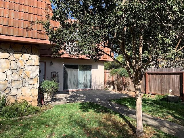 Gated front/backyard looking to front door and living room access