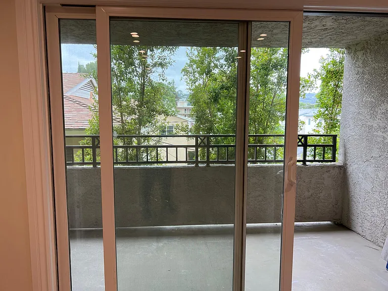 Balcony. One of only 2 units in building with a view of the hills. You can watch some pretty sunsets from the balcony or your couch.