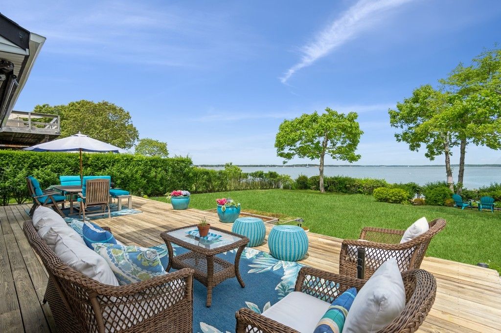 View of Bay from Oversized Deck. Plenty of comfortable seating plus outdoor dining table.
