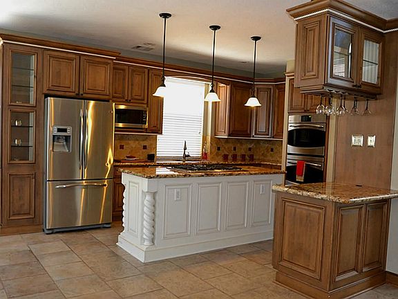 GORGEOUS ISLAND KITCHEN w/Custom Cabinets, Stainless Appliances (FRIDGE STAYS), Granite Counters and Pendant Lights