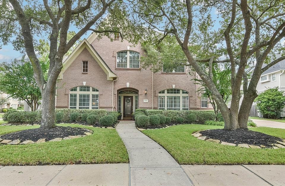 Welcome Home! 22810 Eagle Watch Court nestled on a cul de sac lot in the much sought after gated Cinco Ranch North Lake Village