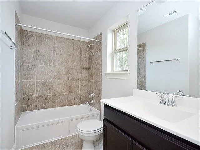 Upgraded bathrooms with dual flush and vanity