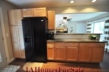 Kitchen with maple cabinets and beautiful rustic laminate flooring.  Open into dining or family room with buffet top.