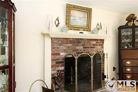Wood burning fireplace in living room