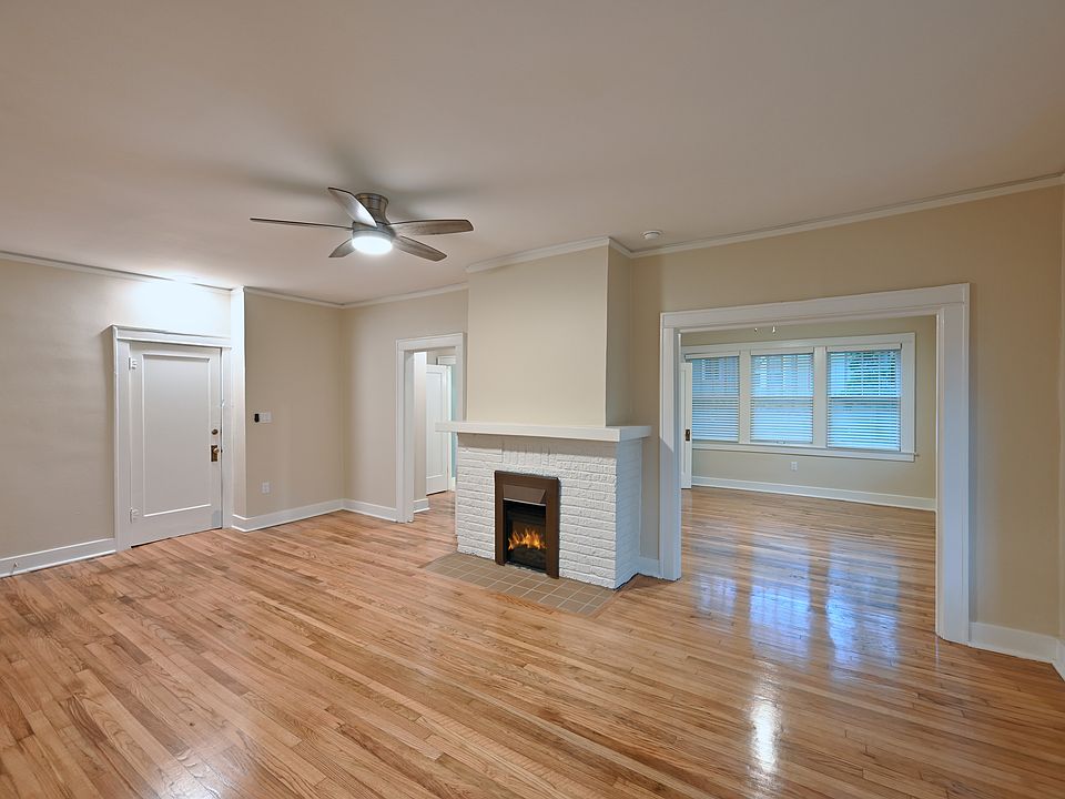 Front hall door and living room. Fireplace is electric radiant heat.