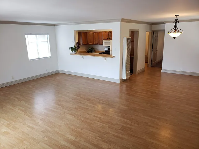 Dining room and kitchen as viewed from fireplace.