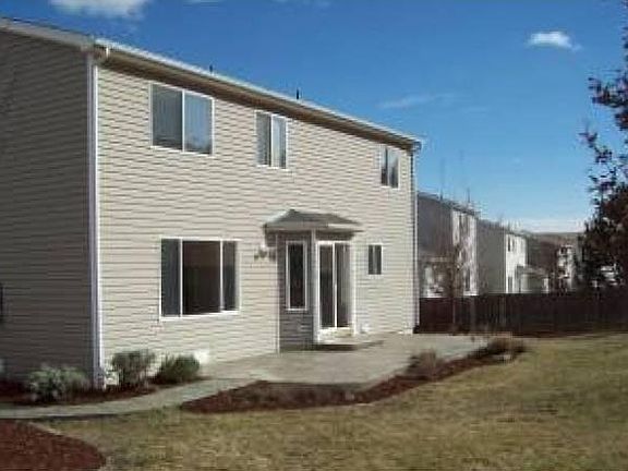 Private fenced yard with open space behind