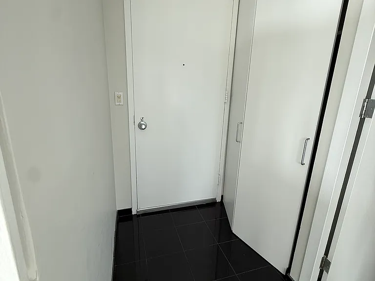 Front door, coat closet on right.