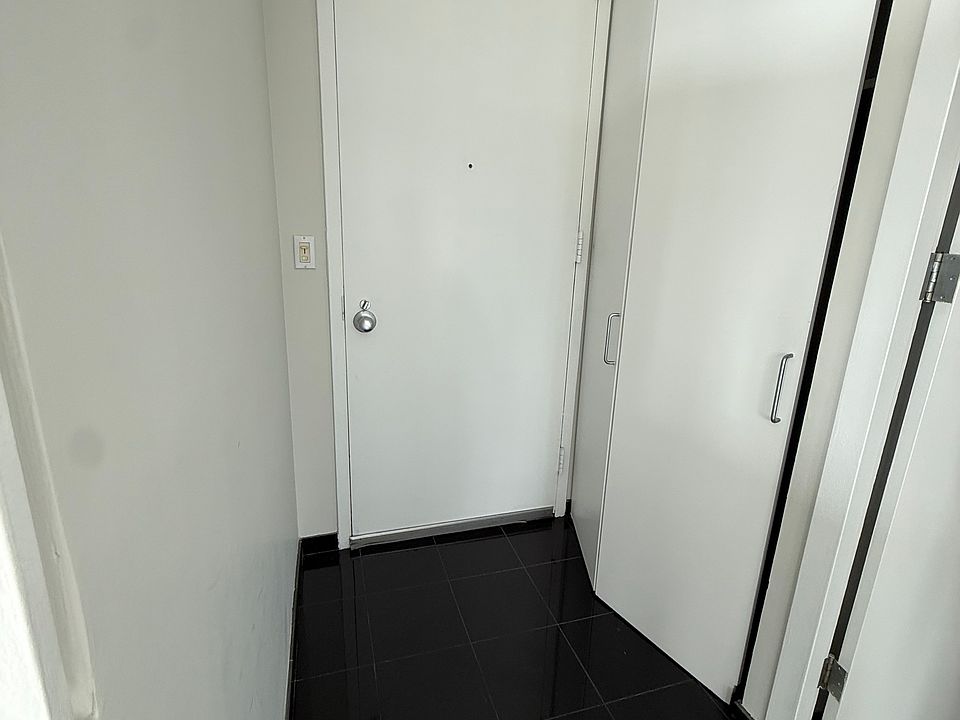Front door, coat closet on right.
