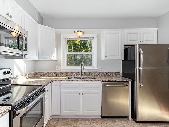 Kitchen is open to the dining room and the door to the back deck.