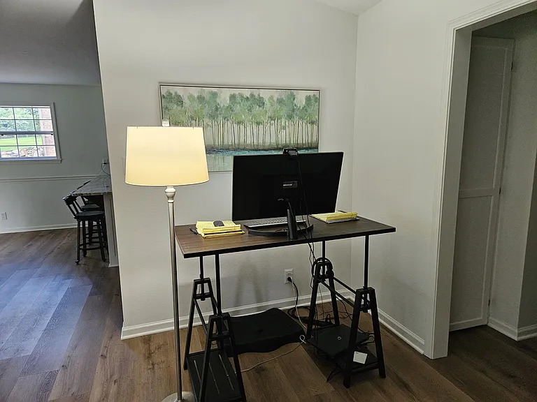 Work desk and work area with view out the front windows. There are other areas in the home where a home office may be created, including a large closet with a window to the back yard.