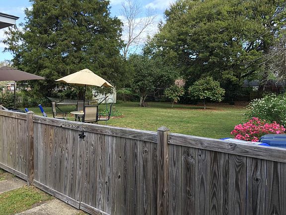 View from front yard, over fence into back yard