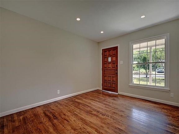Formal living room as you enter this warm mid century remodel.