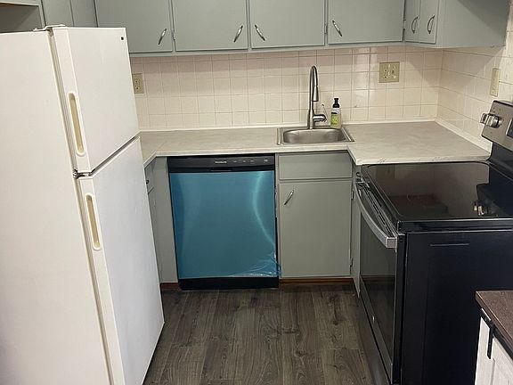 Kitchen - brand new dishwasher, sink, faucet, counter top - newer stove