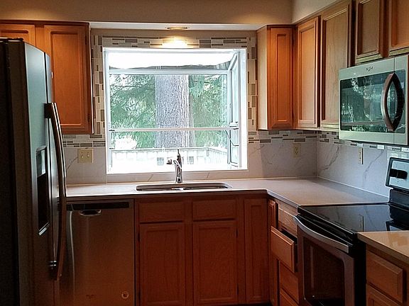 Updated kitchen with quartz countertop and new SS Appliance