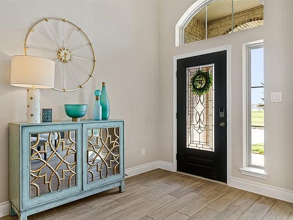 Leaded Glass Door and Sidelight Allows an Abundance of light to pour into the spacious foyer.