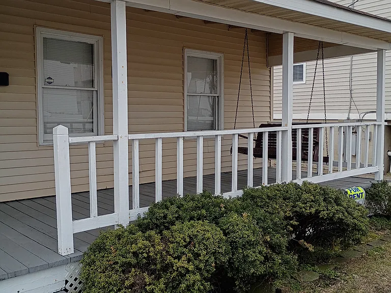 Covered front porch with swing