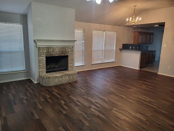 living room, formal dining area and kitchen entrance.