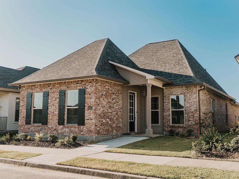 An exterior view of your next stay in an expertly maintained property, built in 2022. The home is one mile from a newly developed golf course.