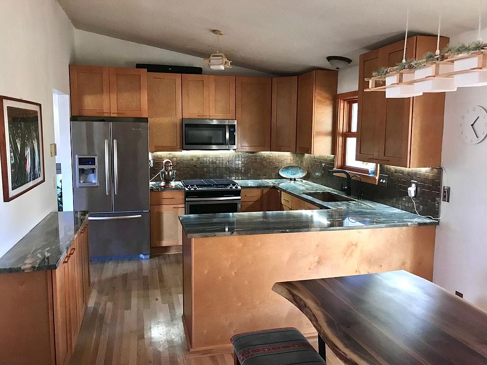 Recently updated kitchen with quartzite countertops.