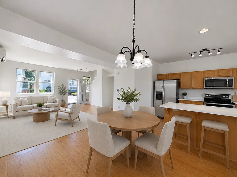 Open concept living room, dining room, and kitchen with a powder room on the main floor and ductless A/C and heat