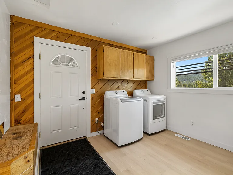 Laundry Area and mudroom for all your outdoor equipment. Additional shed outside if desired.