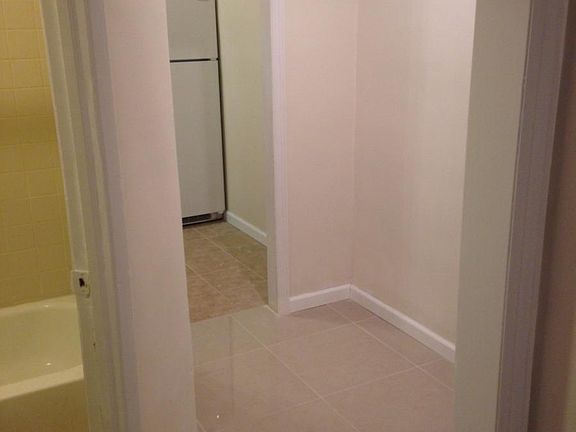 Entrance to kitchen and partial bath view