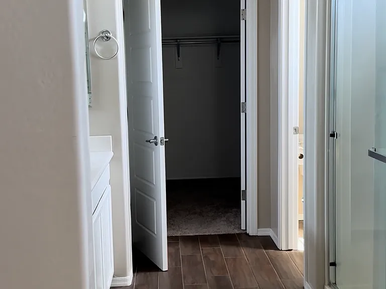 Primary bathroom and walkin closet