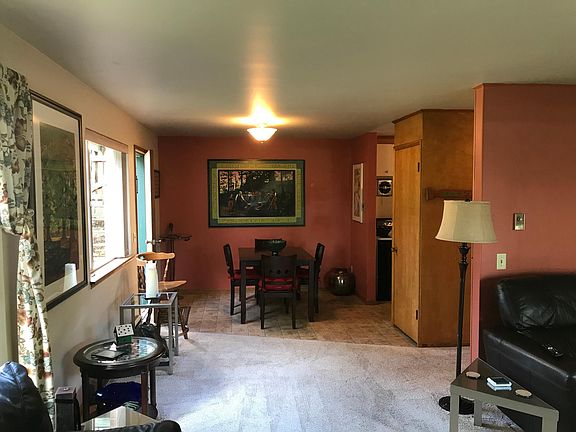 Eating space is next to the main door to the apartment.