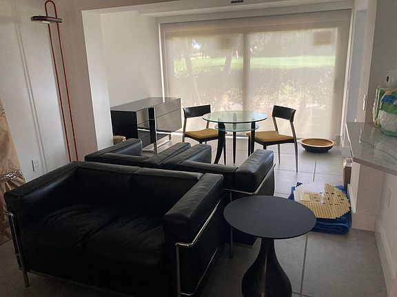 Living area and breakfast area with furniture