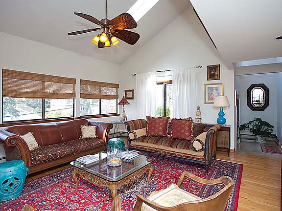 Living Room with vaulted ceiling and skylights