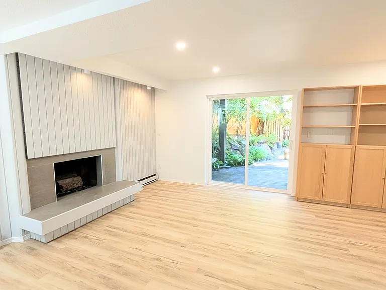 Walkout basement family room, new paint, flooring and lighting